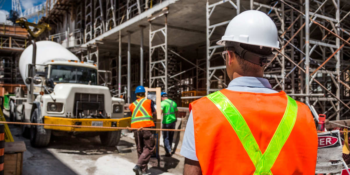 construction worker looking at a construction ssite