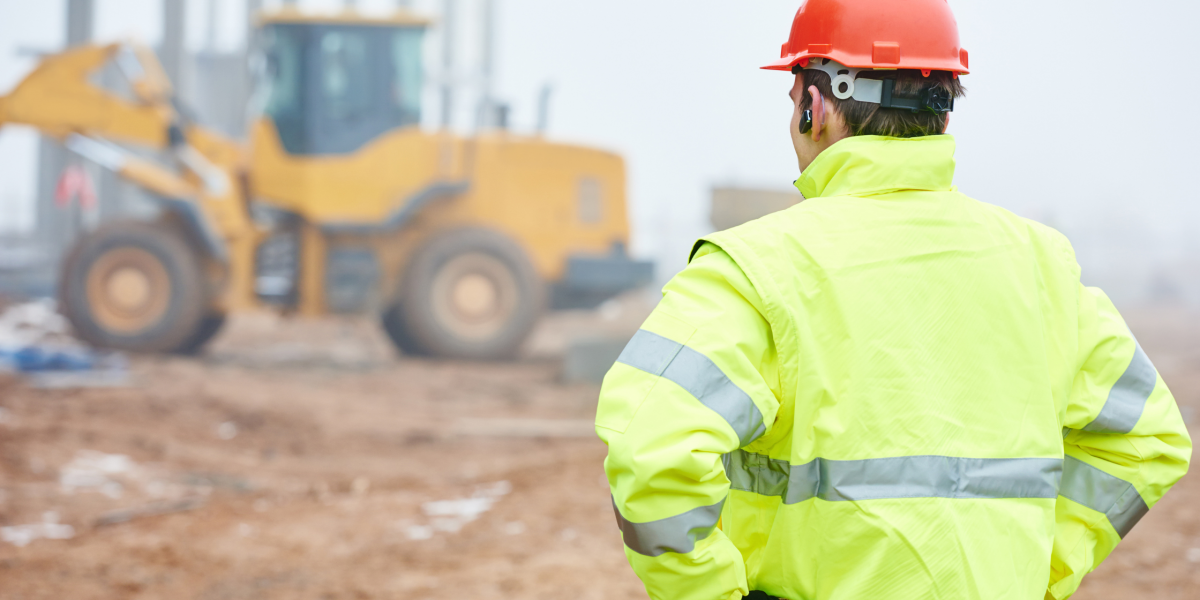 construction worker looking at a construction site