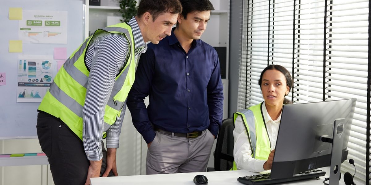 Software,Engineers,Working,On,Computer,Monitor,And,Talking,About,Work