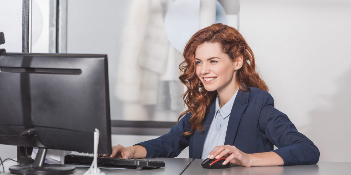 Young,Happy,Manageress,Using,Computerat,Workplace